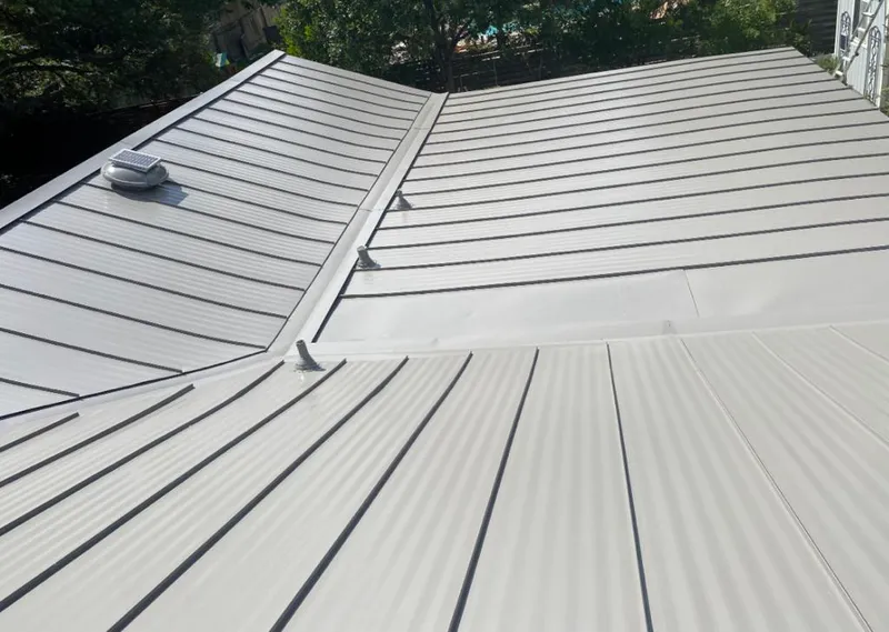 Solar attic fan installed on a metal roof for Roof Ventilation in St. Helena